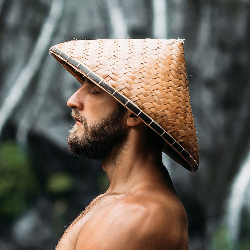 portrait of a sports guy in an asian conical hat g7mbg64.jpg