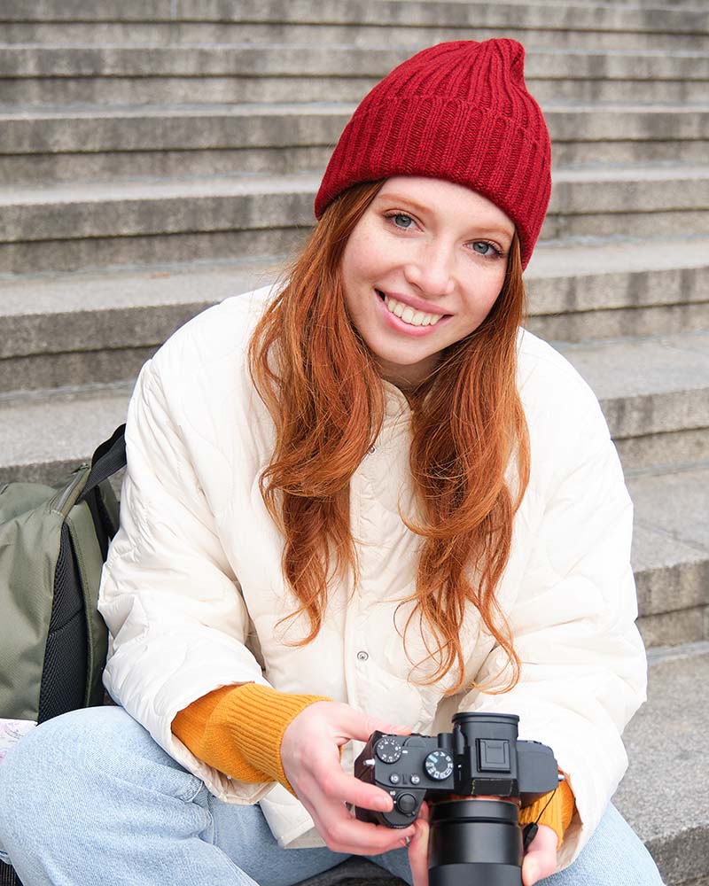 portrait of young photographer girl sits on stair ufcvyl7.jpg